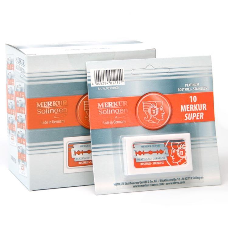A box and individual packaging of Merkur Super Platinum Double Edge Shaving Blades, with 10 blades per pack, wrapped in wax paper.